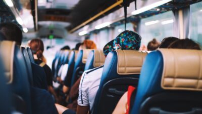 selective focus photography of people on bus