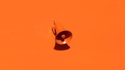 orange megaphone on orange wall