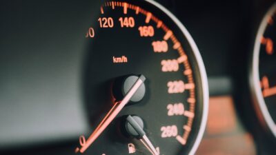 closeup photo of black analog speedometer