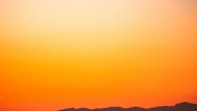 silhouette of city buildings during sunset