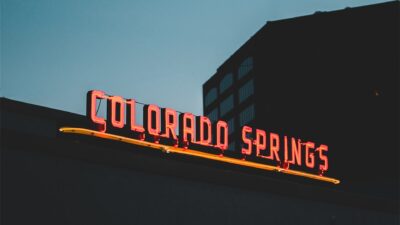 a neon sign on the side of a building