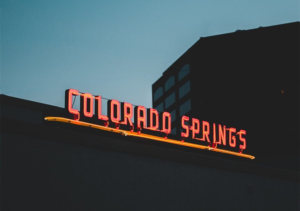 a neon sign on the side of a building